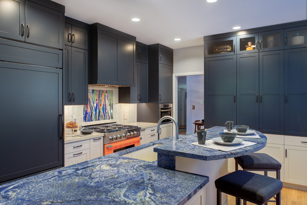 This is an example of a transitional separate kitchen in San Francisco with an undermount sink, shaker cabinets, blue cabinets, multi-coloured splashback, coloured appliances, with island and blue benchtop.