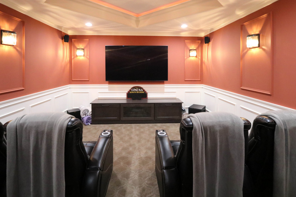 Large transitional home theatre in Cleveland with beige walls.