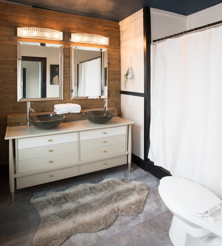 Inspiration for a small transitional brown tile travertine floor and gray floor alcove bathtub remodel with furniture-like cabinets, beige cabinets, a two-piece toilet, white walls, a vessel sink, wood countertops and beige countertops