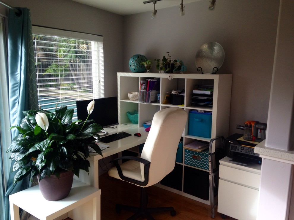 Home office and kids tv room combo with awkward wall angles
