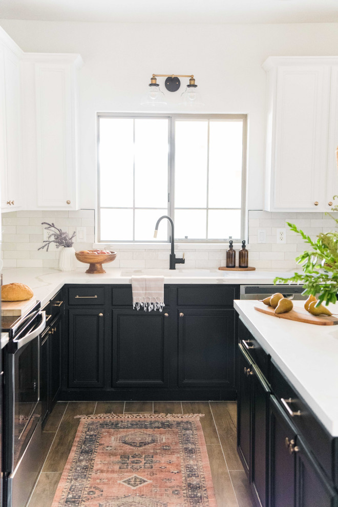 Open concept kitchen - mid-sized transitional l-shaped open concept kitchen idea in Phoenix with white backsplash, ceramic backsplash, stainless steel appliances and an island