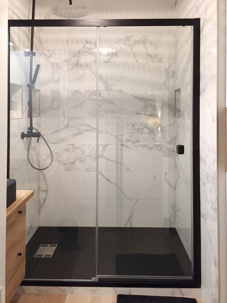 This is an example of a small transitional master bathroom in Paris with beaded inset cabinets, white cabinets, a curbless shower, white tile, light hardwood floors, a console sink, wood benchtops, a sliding shower screen, marble, white walls and white floor.