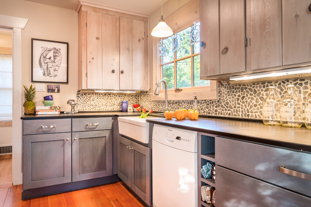 Inspiration for a beach style separate kitchen in Seattle with a farmhouse sink, shaker cabinets, blue cabinets, stone tile splashback and white appliances.