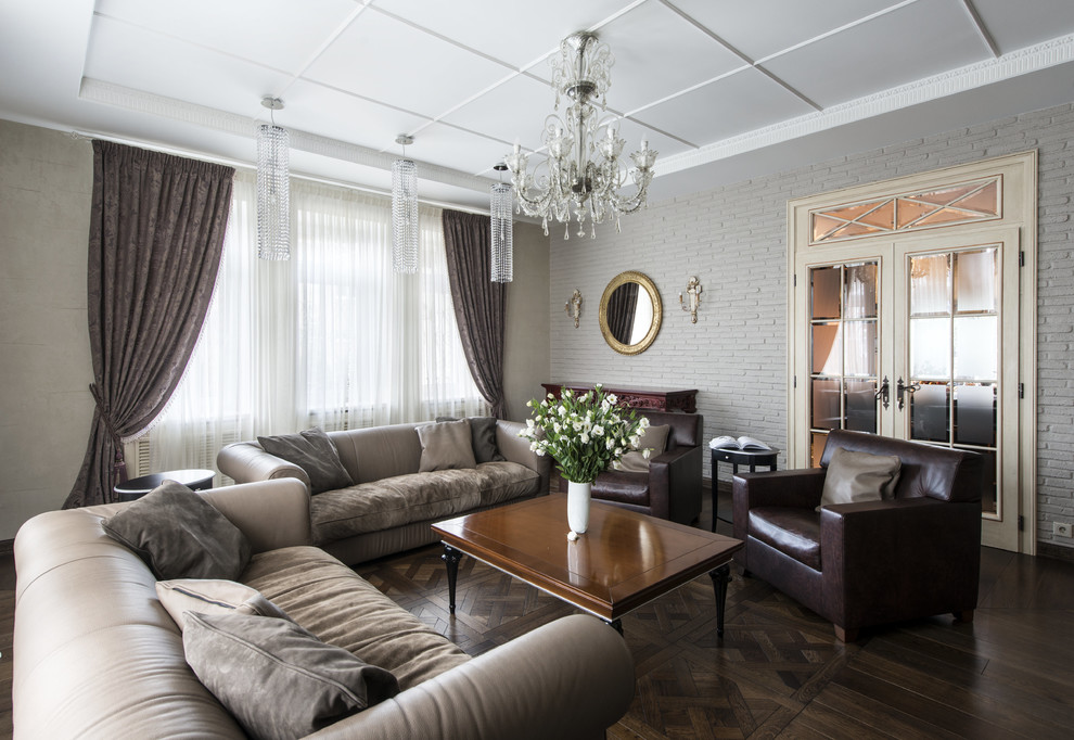 Photo of a traditional enclosed living room in Moscow with a library, a standard fireplace, a stone fireplace surround and a wall-mounted tv.