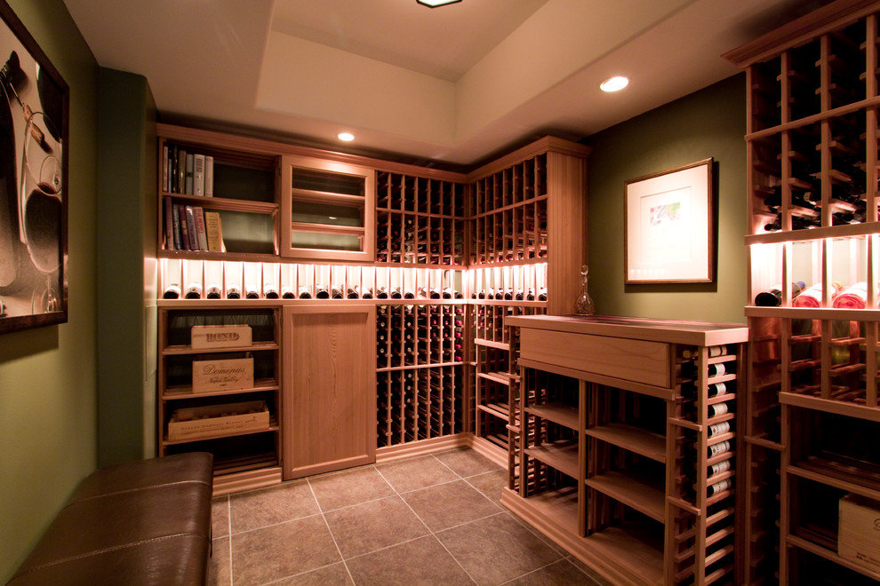 This is an example of a traditional wine cellar in Other with ceramic floors and storage racks.