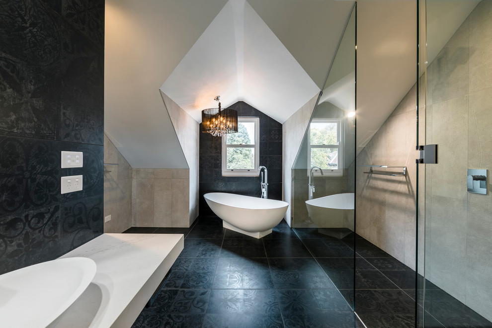 Inspiration for a mid-sized contemporary master bathroom in Sydney with an open shower, stone tile, a freestanding tub, beige tile, beige walls and a hinged shower door.