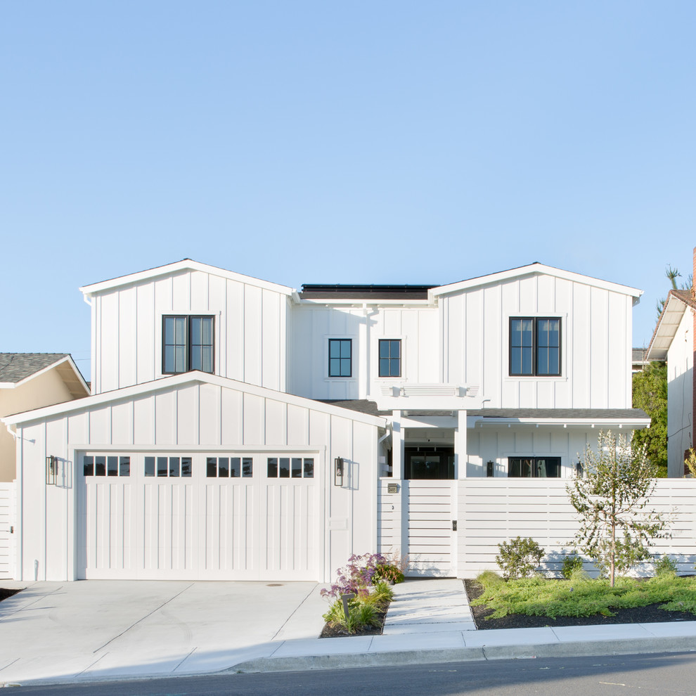 Small country two-storey white house exterior in San Francisco with wood siding and a gable roof.