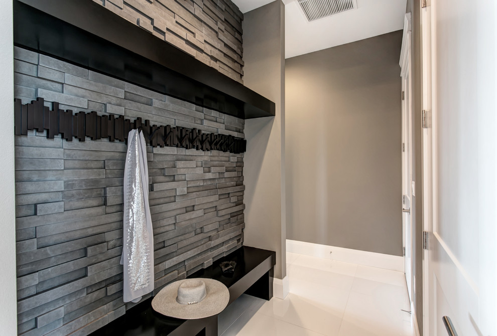 Example of a mid-sized trendy white floor mudroom design in Seattle with gray walls and a black front door