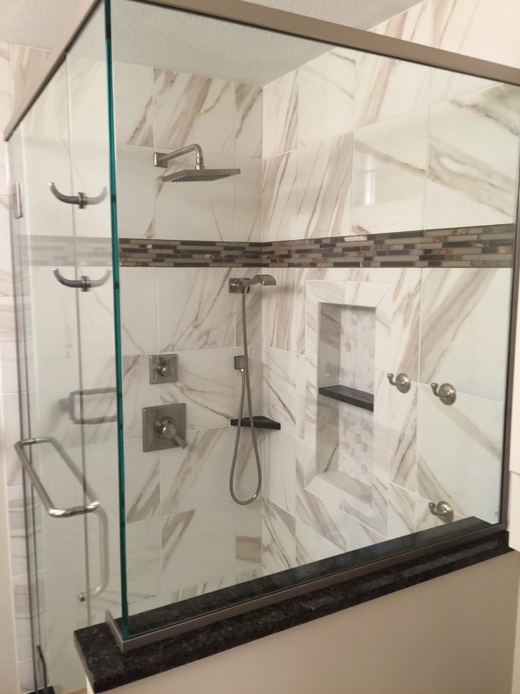 Corner shower - mid-sized transitional master white tile and porcelain tile porcelain tile corner shower idea with beige walls