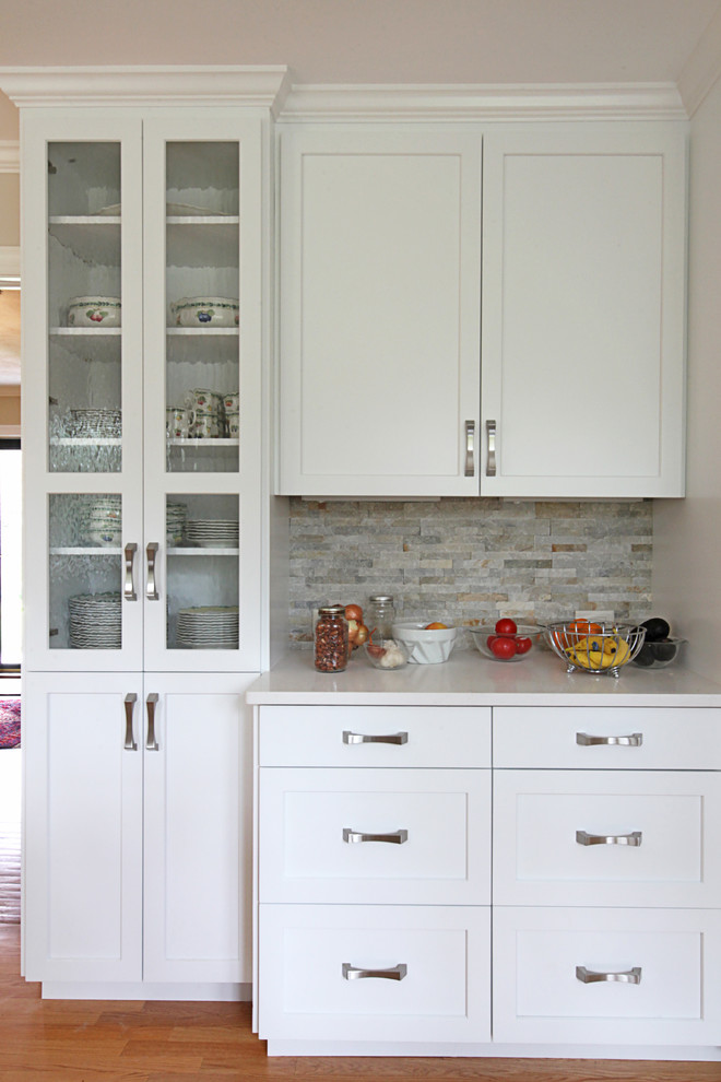 Eat-in kitchen - mid-sized transitional u-shaped eat-in kitchen idea with flat-panel cabinets, white cabinets and a peninsula