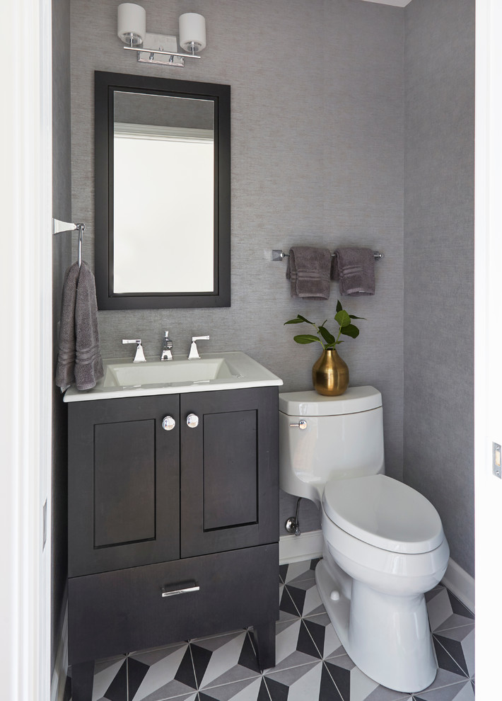 Inspiration for a small transitional 3/4 bathroom in Chicago with shaker cabinets, dark wood cabinets, a one-piece toilet, grey walls, porcelain floors, an integrated sink, multi-coloured floor and white benchtops.