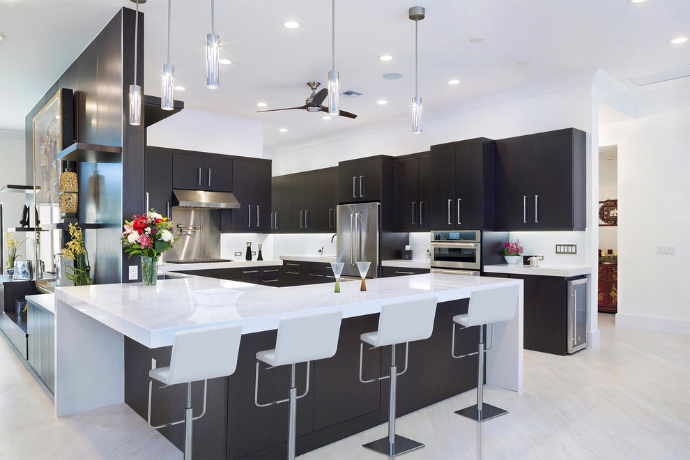 Design ideas for a large u-shaped eat-in kitchen in Miami with an undermount sink, black cabinets, marble benchtops, white splashback, stainless steel appliances, marble floors, a peninsula and white floor.