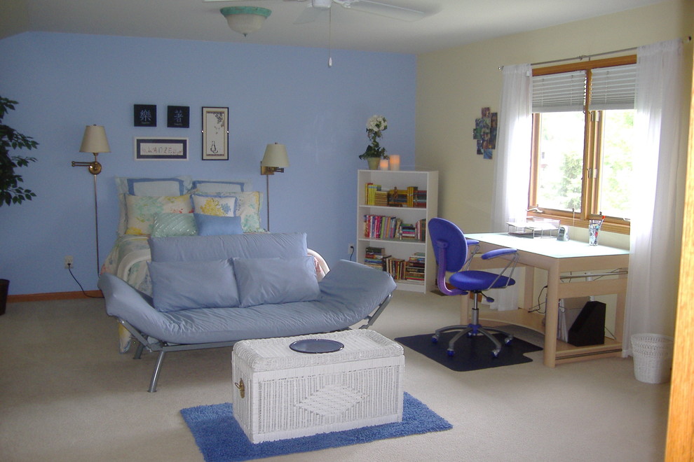 This is an example of a mid-sized transitional guest bedroom in Other with blue walls and carpet.