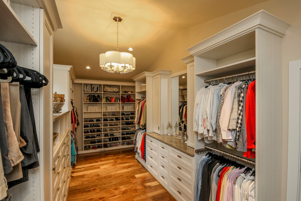 Large transitional gender-neutral walk-in wardrobe in Other with recessed-panel cabinets.