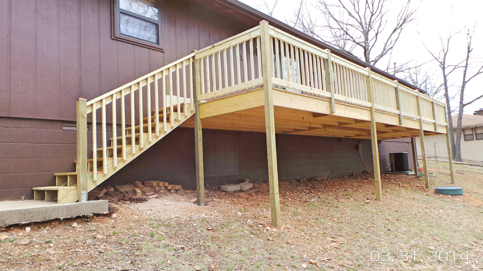 Inspiration for a mid-sized backyard deck remodel with decking and no cover