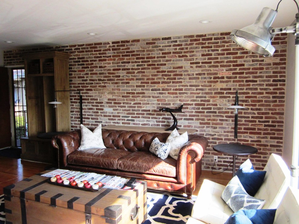 Example of a mid-sized urban formal and loft-style medium tone wood floor living room design in Los Angeles with red walls and no tv