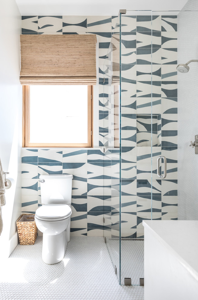 Design ideas for a contemporary 3/4 bathroom in San Francisco with a curbless shower, blue tile, multi-coloured tile, white tile, multi-coloured walls, white floor, a hinged shower door and cement tile.