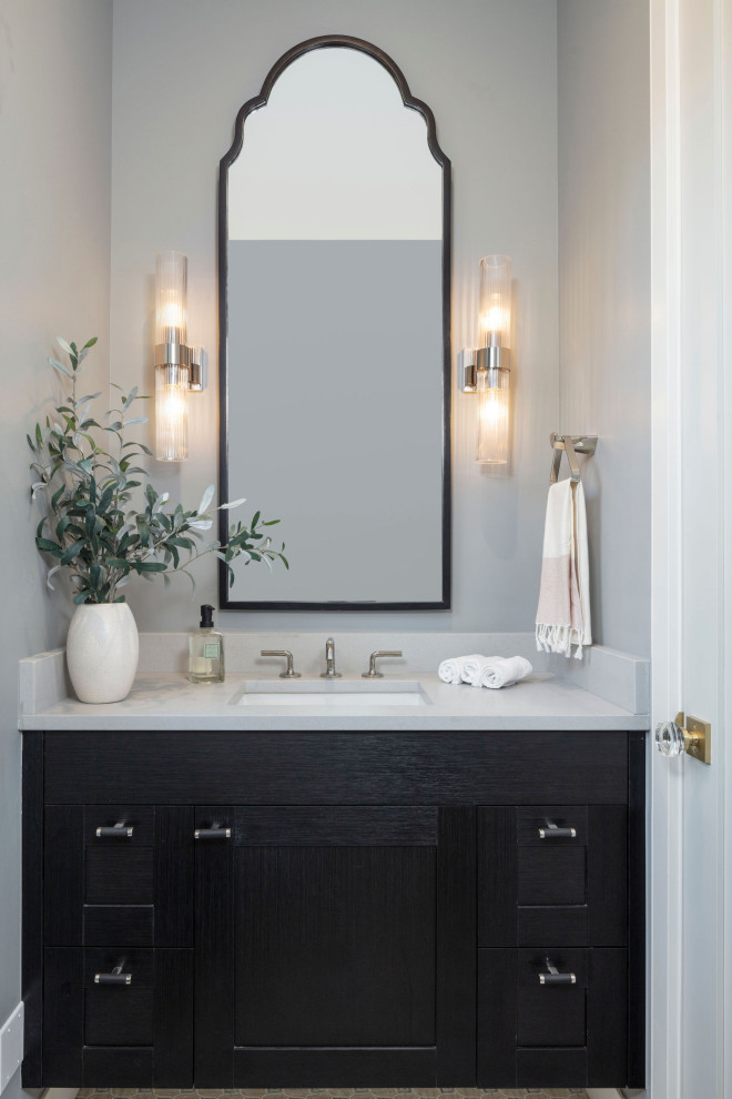 Medium sized traditional cloakroom in Denver with shaker cabinets, black cabinets, a one-piece toilet, grey walls, ceramic flooring, a submerged sink, marble worktops, multi-coloured floors, white worktops and a floating vanity unit.