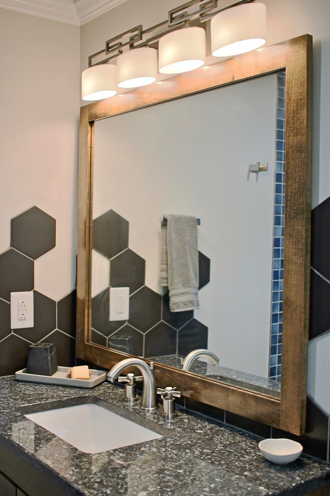 Photo of a small midcentury master bathroom in Raleigh with flat-panel cabinets, medium wood cabinets, beige walls, ceramic floors, an undermount sink, granite benchtops, black floor, blue benchtops, black tile and ceramic tile.
