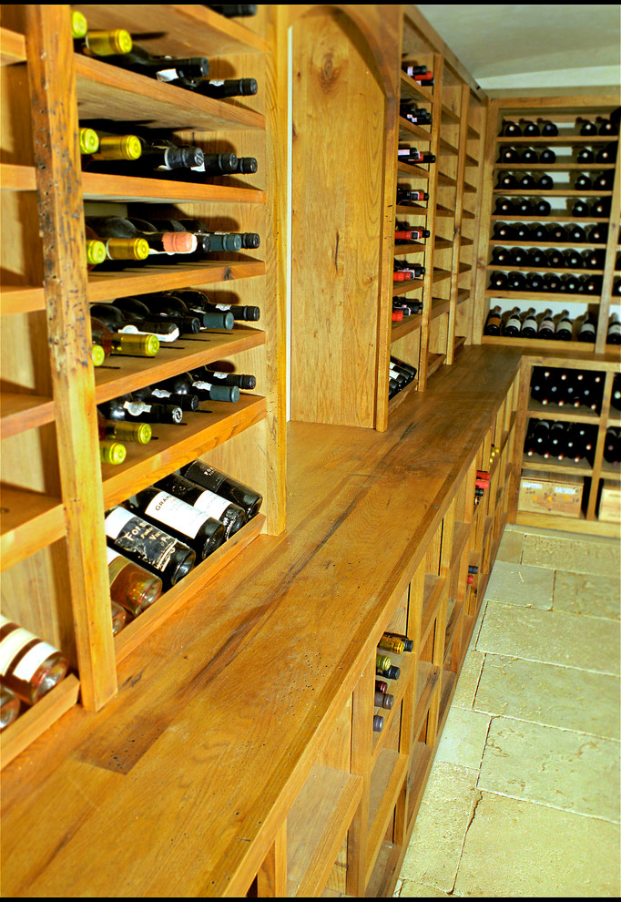 Example of a large farmhouse wine cellar design in New York