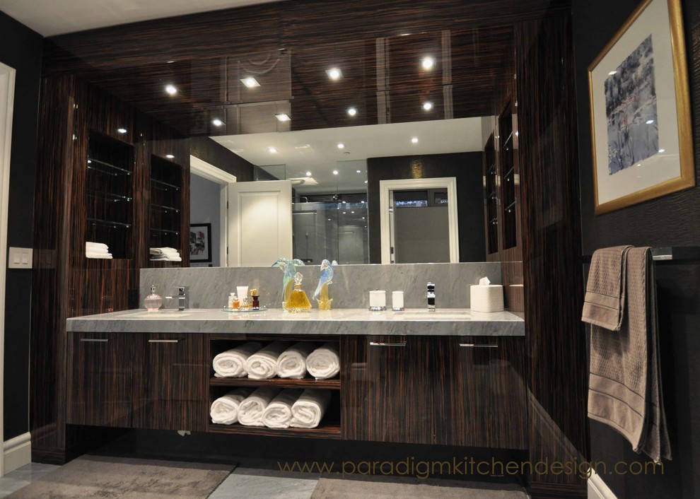Inspiration for a large contemporary master bathroom in Vancouver with flat-panel cabinets, dark wood cabinets, black walls, porcelain floors and marble benchtops.