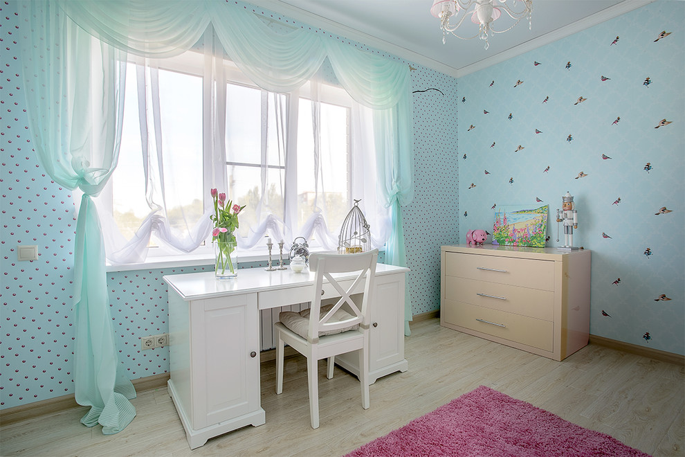 Photo of a contemporary kids' study room for kids 4-10 years old and girls in Moscow with blue walls and light hardwood floors.