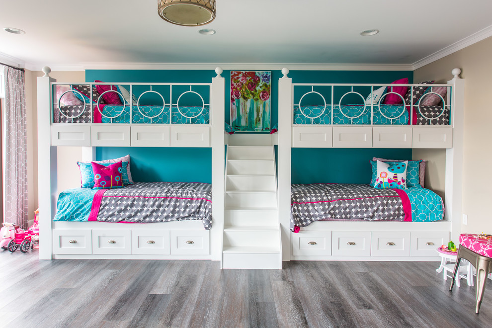 Large transitional kids' bedroom in Other with blue walls and dark hardwood floors for kids 4-10 years old and girls.