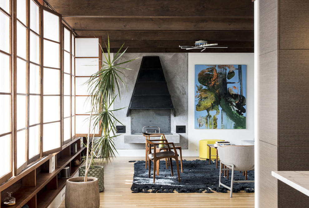Example of a small 1960s open concept living room design in Louisville with a concrete fireplace