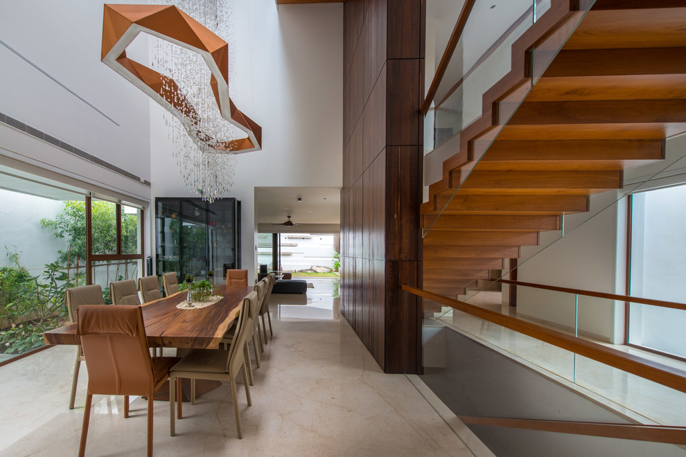 This is an example of a modern dining room in Hyderabad.
