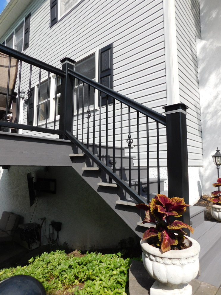 Mid-sized transitional backyard deck photo with no cover