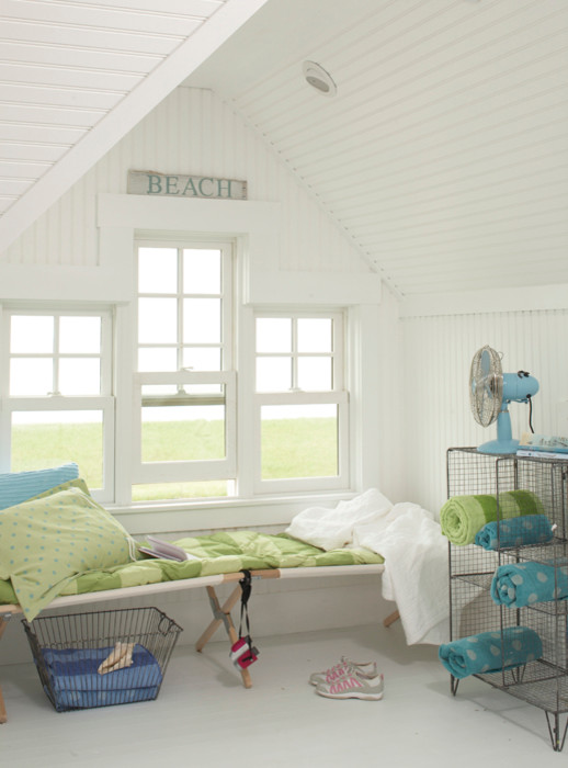 Coastal Living - Inspiration for a mid-sized coastal open concept concrete floor and white floor family room remodel in Tampa with white walls and no fireplace