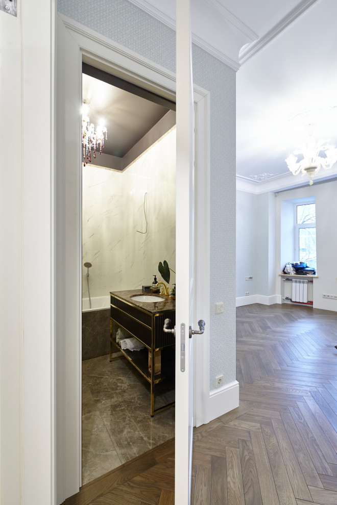 Inspiration for a large traditional hallway in Moscow with grey walls, medium hardwood floors and brown floor.