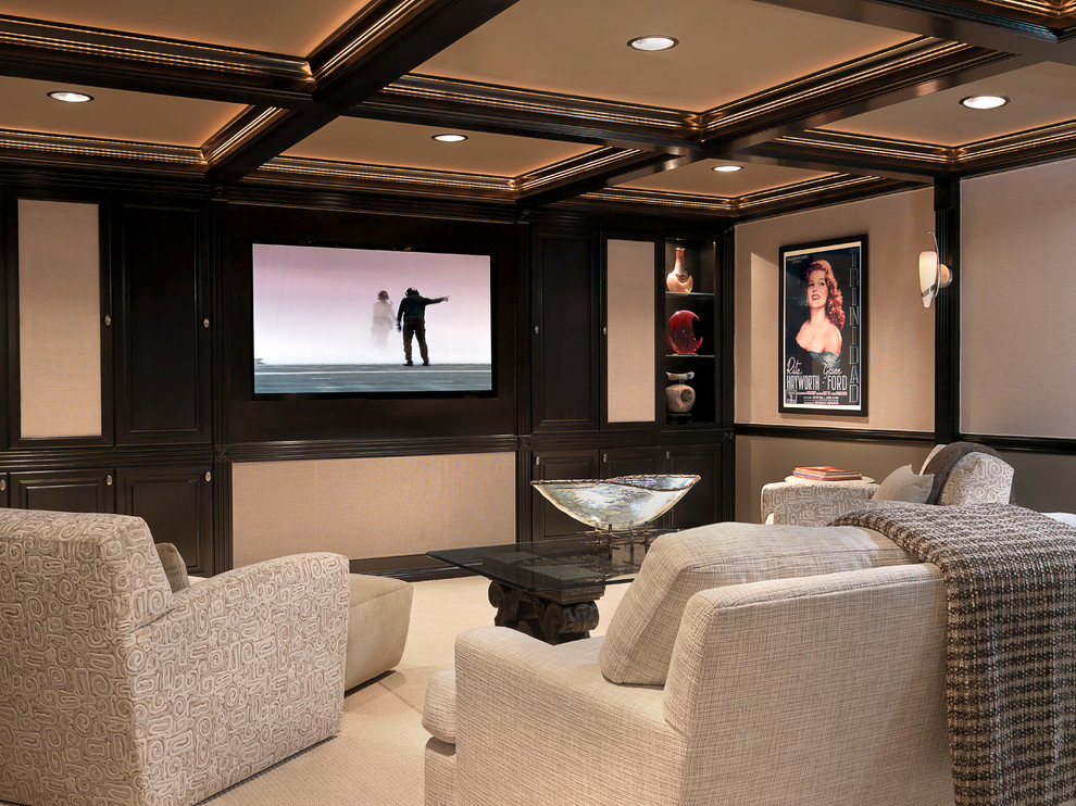 Traditional enclosed home theatre in St Louis with beige walls, carpet, a wall-mounted tv and beige floor.