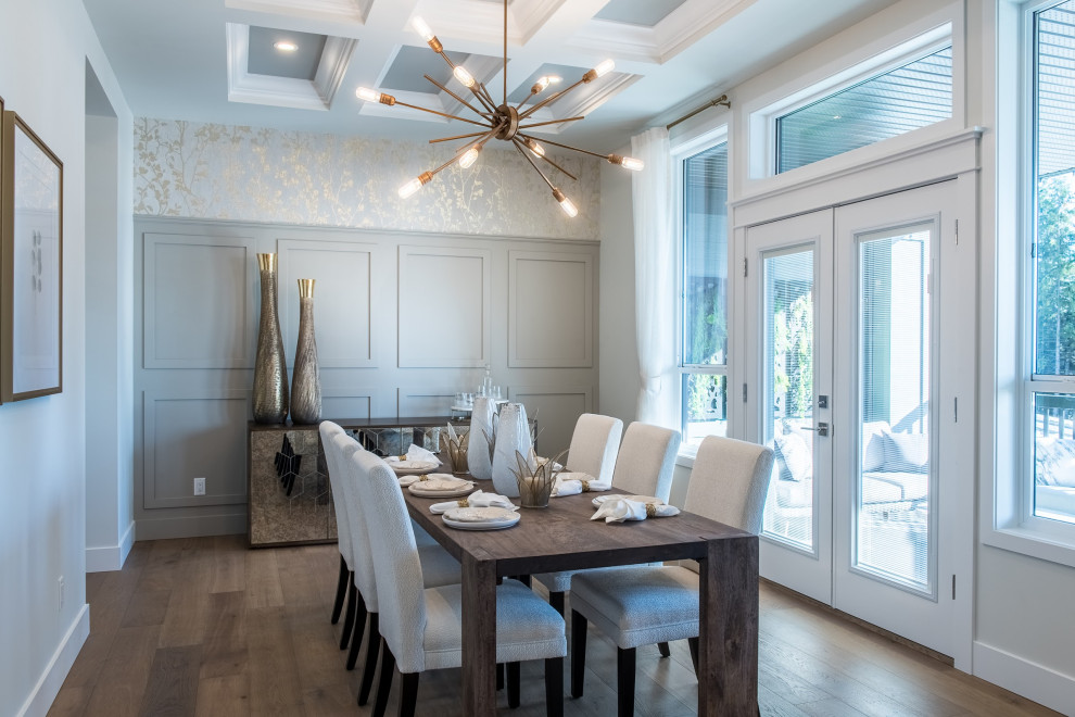 Design ideas for a large transitional dining room in Vancouver with black walls, medium hardwood floors, no fireplace, brown floor, coffered, panelled walls and wallpaper.