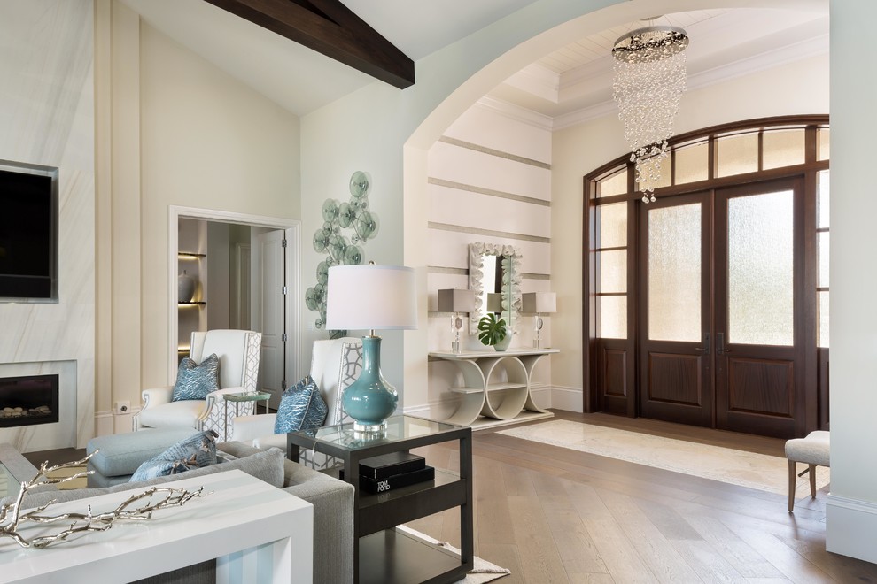 Transitional foyer in Miami with beige walls, light hardwood floors, a double front door, a brown front door and brown floor.