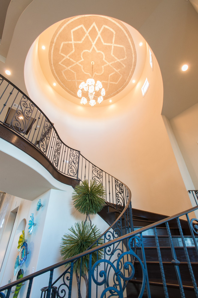 Mid-sized transitional wooden curved wood railing staircase photo with wooden risers