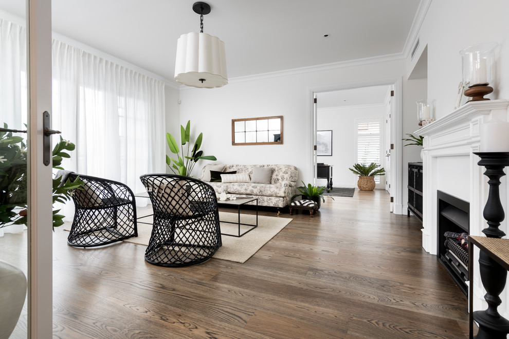 Inspiration for a large transitional formal open concept living room in Perth with white walls, dark hardwood floors, a standard fireplace, a concrete fireplace surround and brown floor.