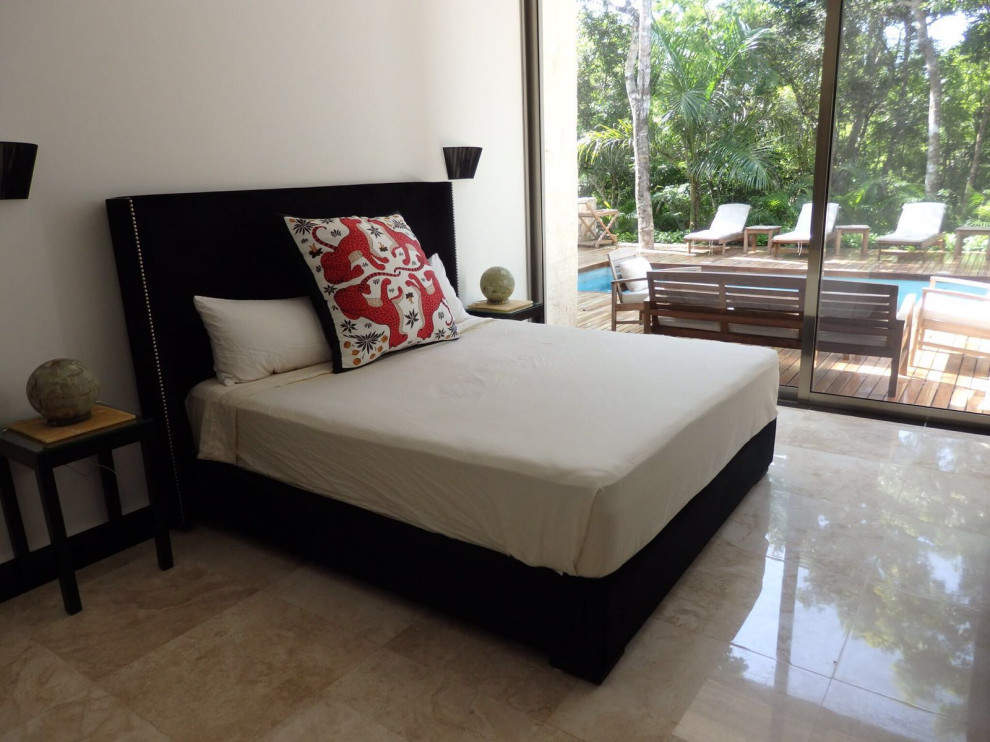 Bedroom - large zen guest limestone floor and beige floor bedroom idea in Madrid with white walls