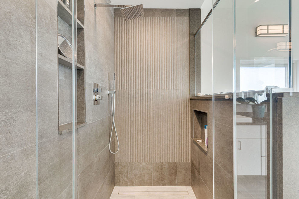 Inspiration for a large contemporary master double-sink corner shower remodel in DC Metro with flat-panel cabinets, white cabinets, concrete countertops, a hinged shower door, a niche and a floating vanity