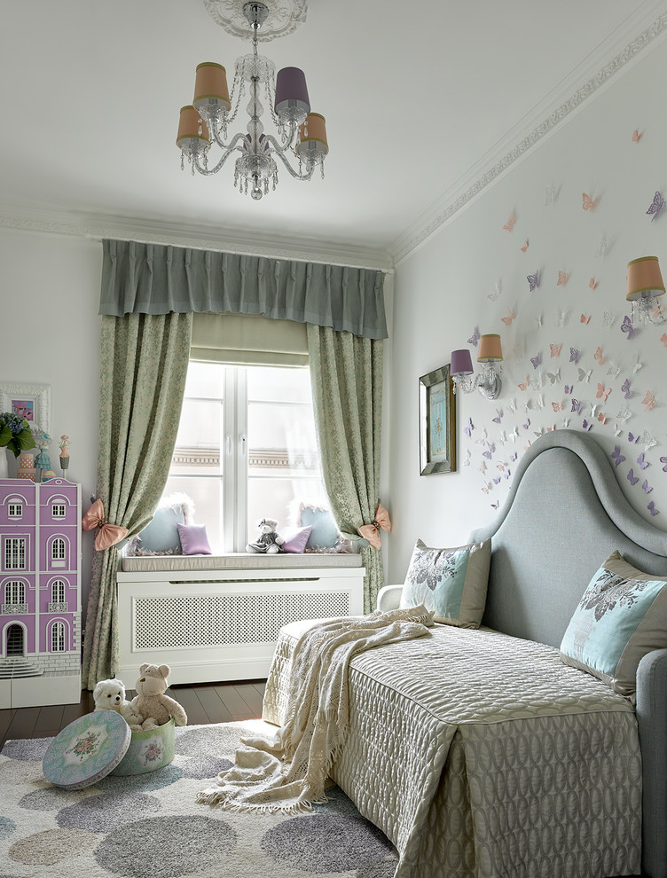 Design ideas for a traditional kids' bedroom for kids 4-10 years old and girls in Moscow with white walls and dark hardwood floors.