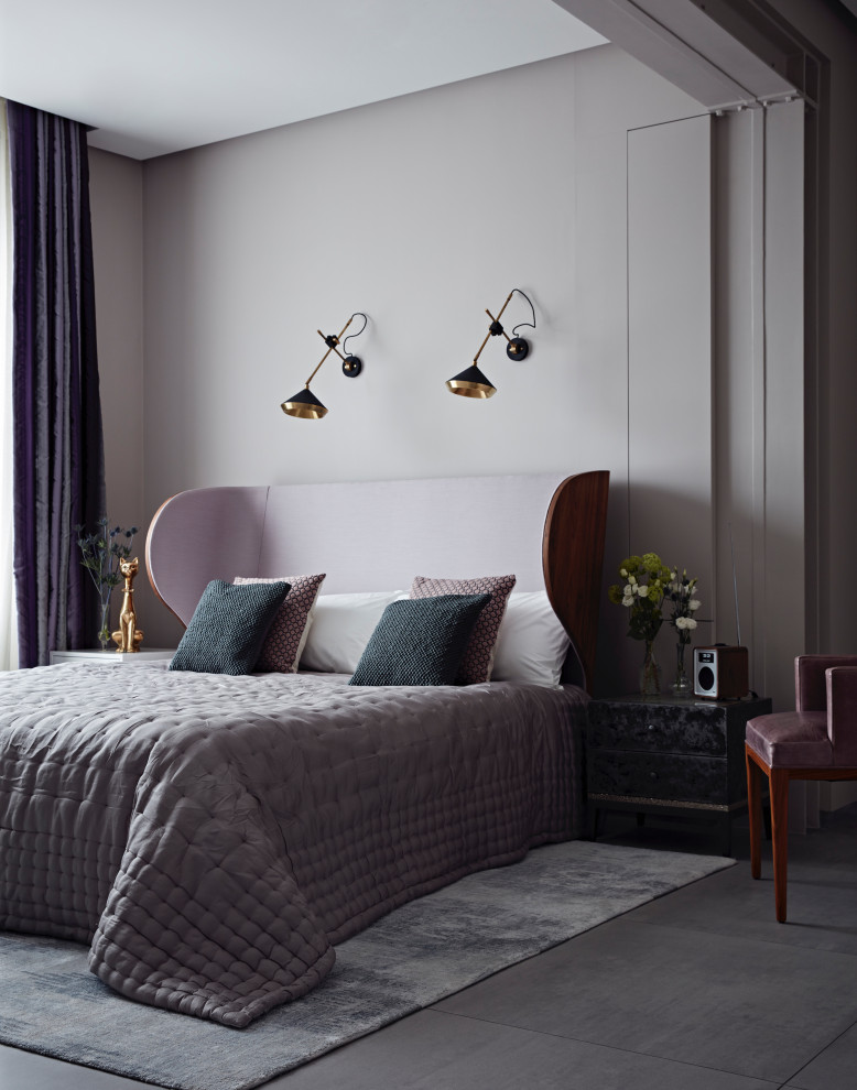 Photo of a contemporary master bedroom in London with porcelain floors, grey walls and grey floor.