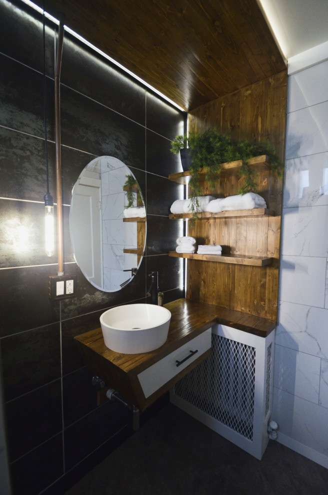 This is an example of a small industrial 3/4 bathroom in Chicago with flat-panel cabinets, medium wood cabinets, an alcove shower, a two-piece toilet, porcelain tile, vinyl floors, a vessel sink, wood benchtops, grey floor, a hinged shower door, brown benchtops, a niche, a single vanity, a floating vanity and wood.