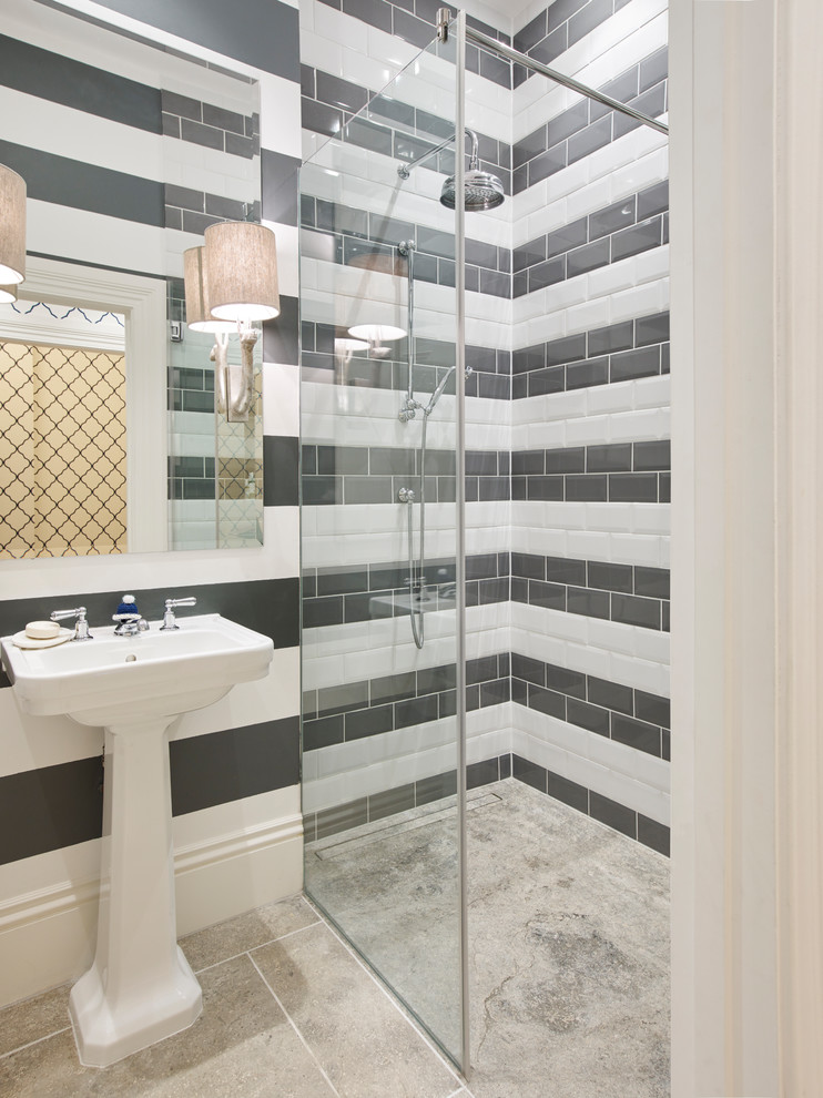 Design ideas for a traditional bathroom in London with black and white tile, subway tile, a console sink, grey floor and an alcove shower.