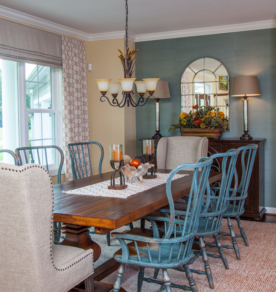 Inspiration for a beach style separate dining room in Baltimore with yellow walls, dark hardwood floors and brown floor.