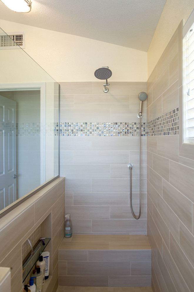 Inspiration for a large transitional master brown tile and porcelain tile ceramic tile walk-in shower remodel in Phoenix with recessed-panel cabinets, dark wood cabinets, a two-piece toilet, beige walls, an undermount sink and granite countertops
