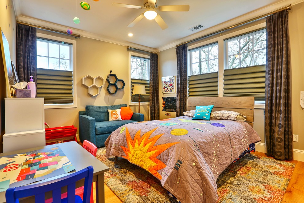 This is an example of a transitional kids' bedroom for kids 4-10 years old and boys in San Francisco with light hardwood floors, beige floor and grey walls.