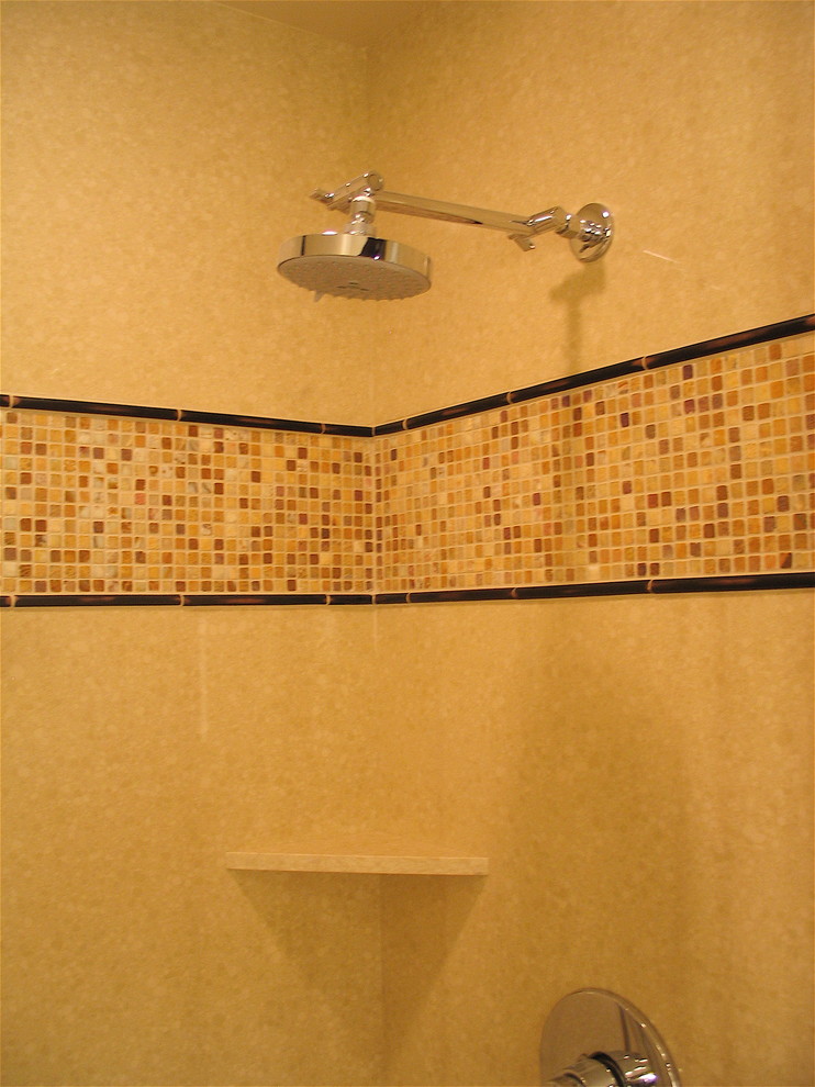 This is an example of a small contemporary master bathroom in San Francisco with a drop-in sink, flat-panel cabinets, dark wood cabinets, engineered quartz benchtops, a drop-in tub, a curbless shower, yellow tile, mosaic tile, beige walls and limestone floors.