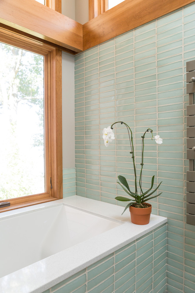 Inspiration for a modern bathroom in Other with glass tile and terrazzo benchtops.