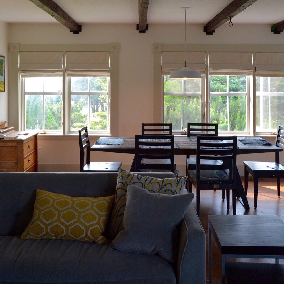 Mid-sized mountain style dark wood floor great room photo with white walls and no fireplace