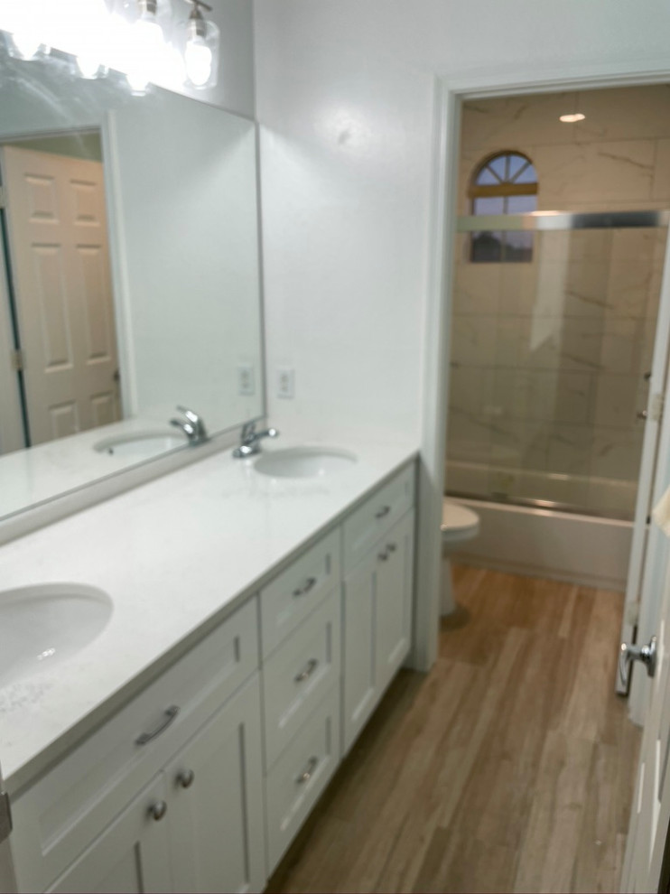 Mid-sized transitional kids' white tile and porcelain tile ceramic tile, beige floor and double-sink alcove bathtub photo in Phoenix with shaker cabinets, white cabinets, white walls, an undermount sink, quartz countertops, white countertops and a built-in vanity